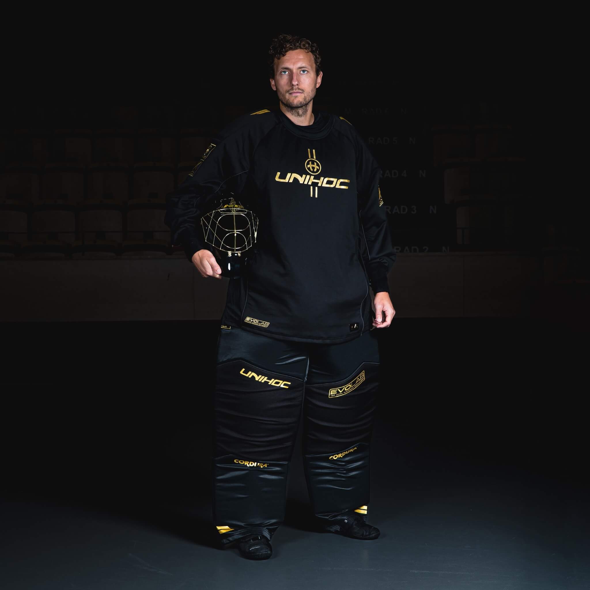 Unihoc Målvaktshjälm ALPHA PRIME Evolab Black/Gold-Innebandy24